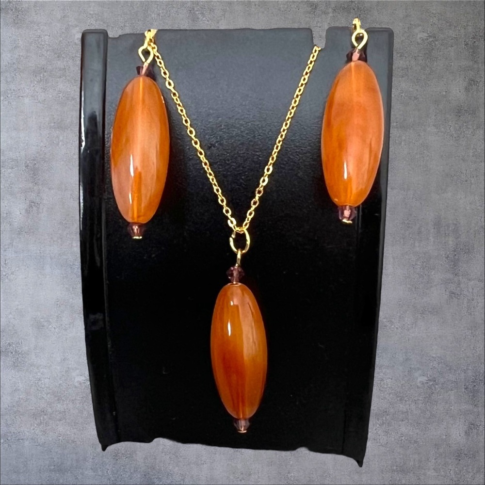 Gold plated long brown earrings set with crystal accents